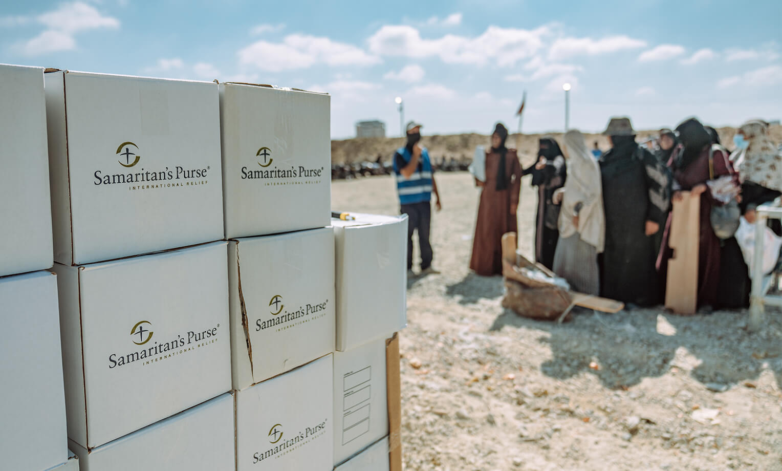 Women stand in line for ready-to-use supplemental nutrition packets in Gaza.