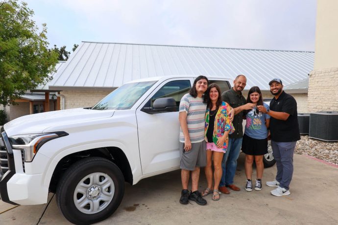 The Mertz family gathered outside Kerrville Bible Church last week to receive a new car from Samaritan's Purse after losing theirs in the flood. 