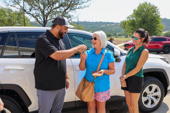 Samaritan's Purse staff gifts new car key to flood survivor in Texas. 