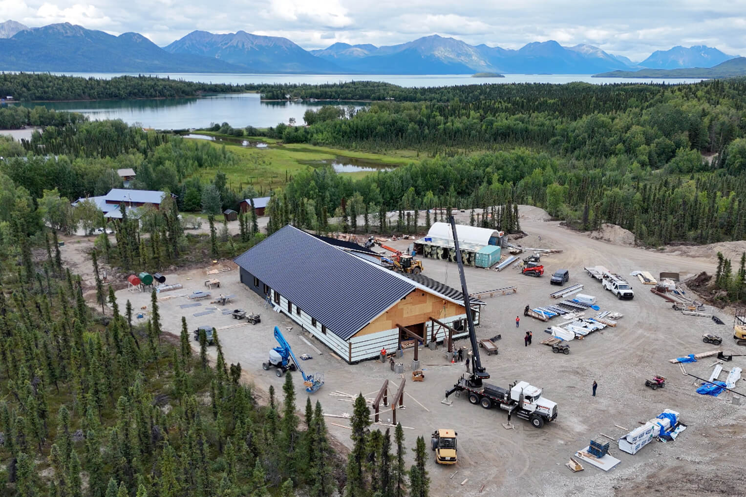 The metal roof is has been placed and construction volunteers are making steady progress on the new building.