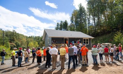Volunteers, friends, and family gathered for the dedication of Sherwood's new home.