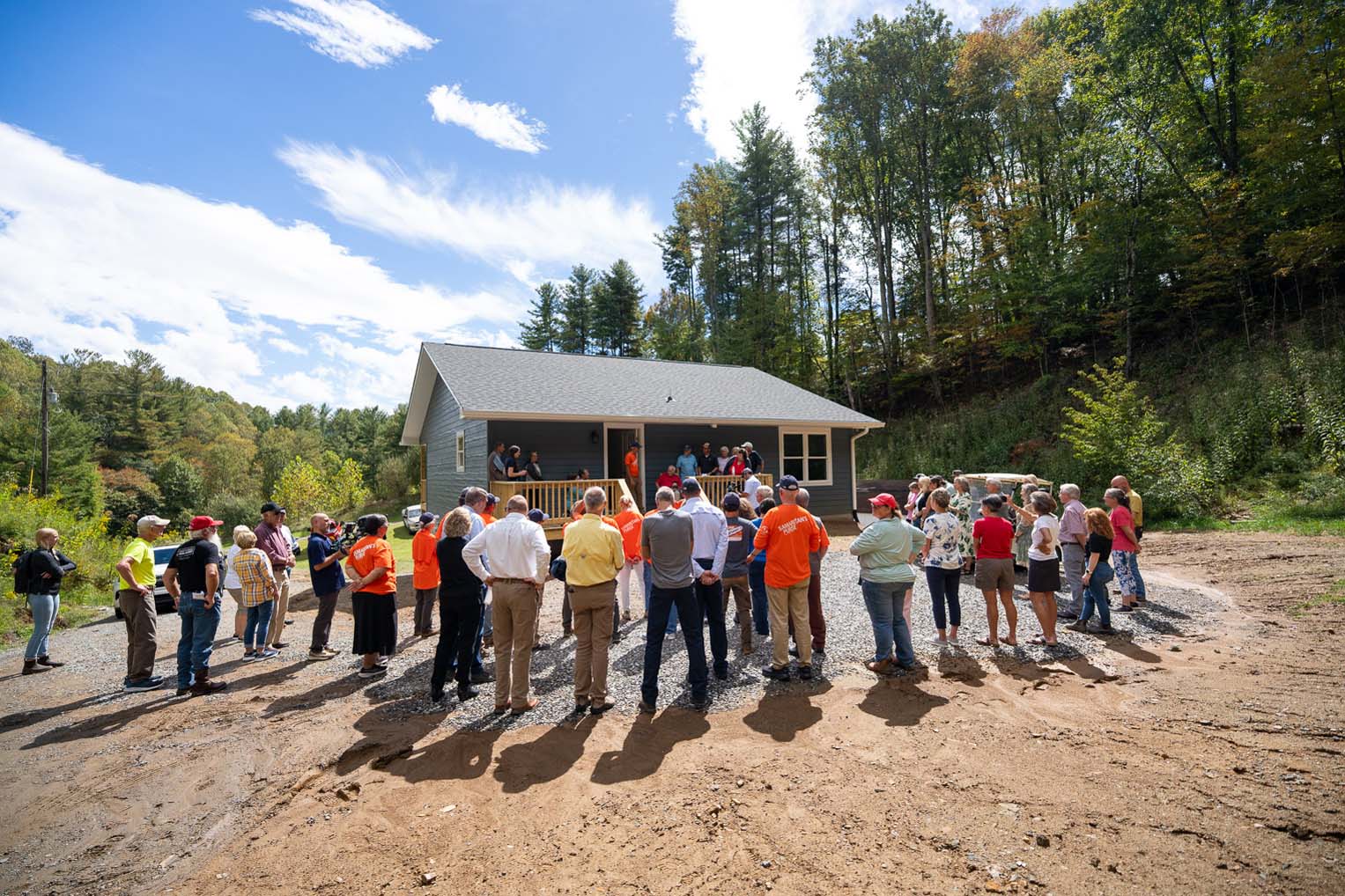 Volunteers, friends, and family gathered for the dedication of Sherwood's new home.