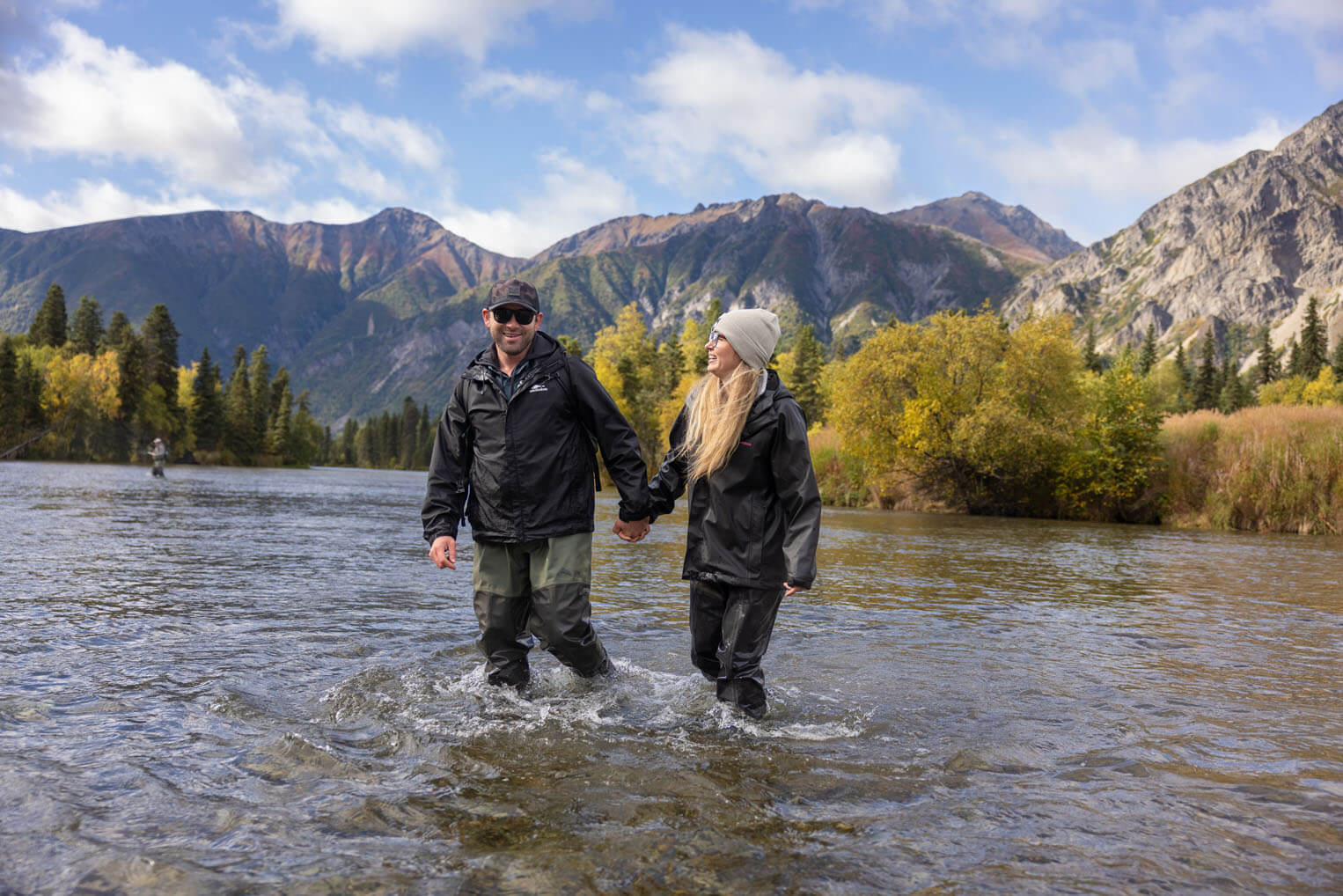 Bryant and Victoria Felix cross the Kijik River, famous for Arctic grayling fishing.