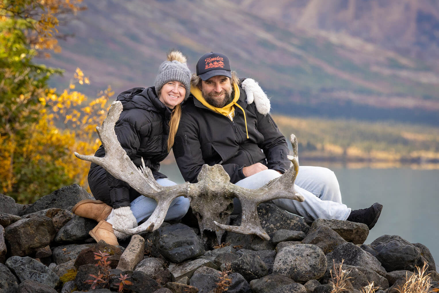 Nate and Andrea Hruska pose for a portrait in Alaska's wilderness.