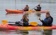 Military couples kayak in Lake Clark through Operation Heal Our Patriots.