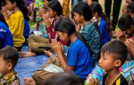 Cambodian children praying at an Operation Christmas Child outreach event