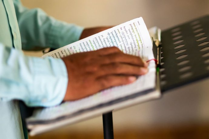 Pastor Ponleu opens the Word of God