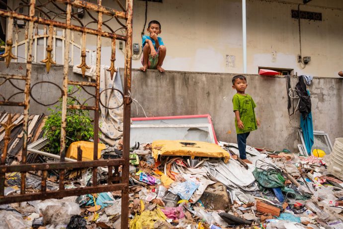 children on trash heap