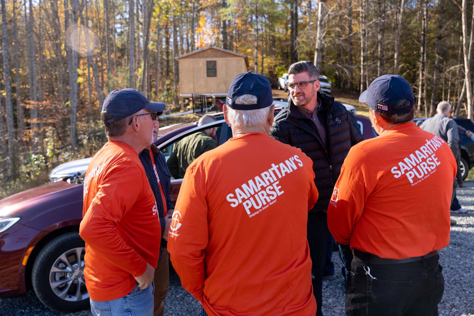 Edward Graham meets with rebuild volunteers at the Bowenses' property.