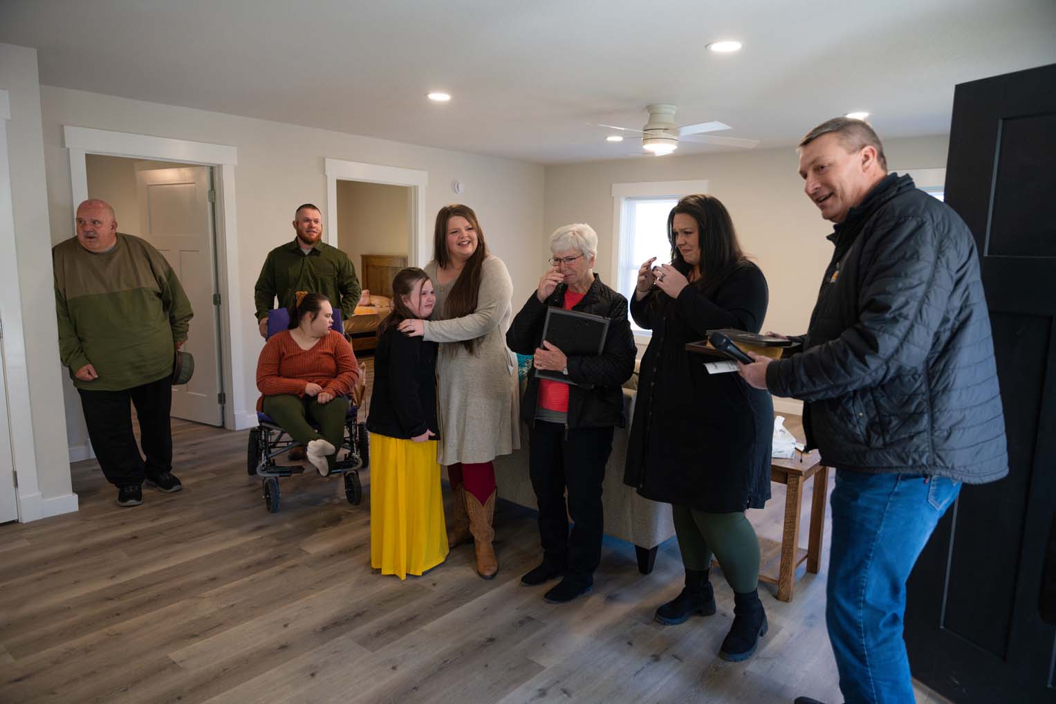 Luther Harrison, vice president of North American Ministries at Samaritan's Purse, joined the family on a tour of their new home.