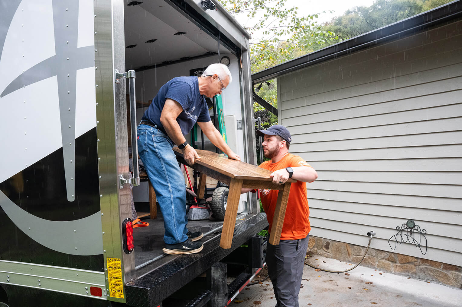 Samaritan's Purse staff unload furniture from truck