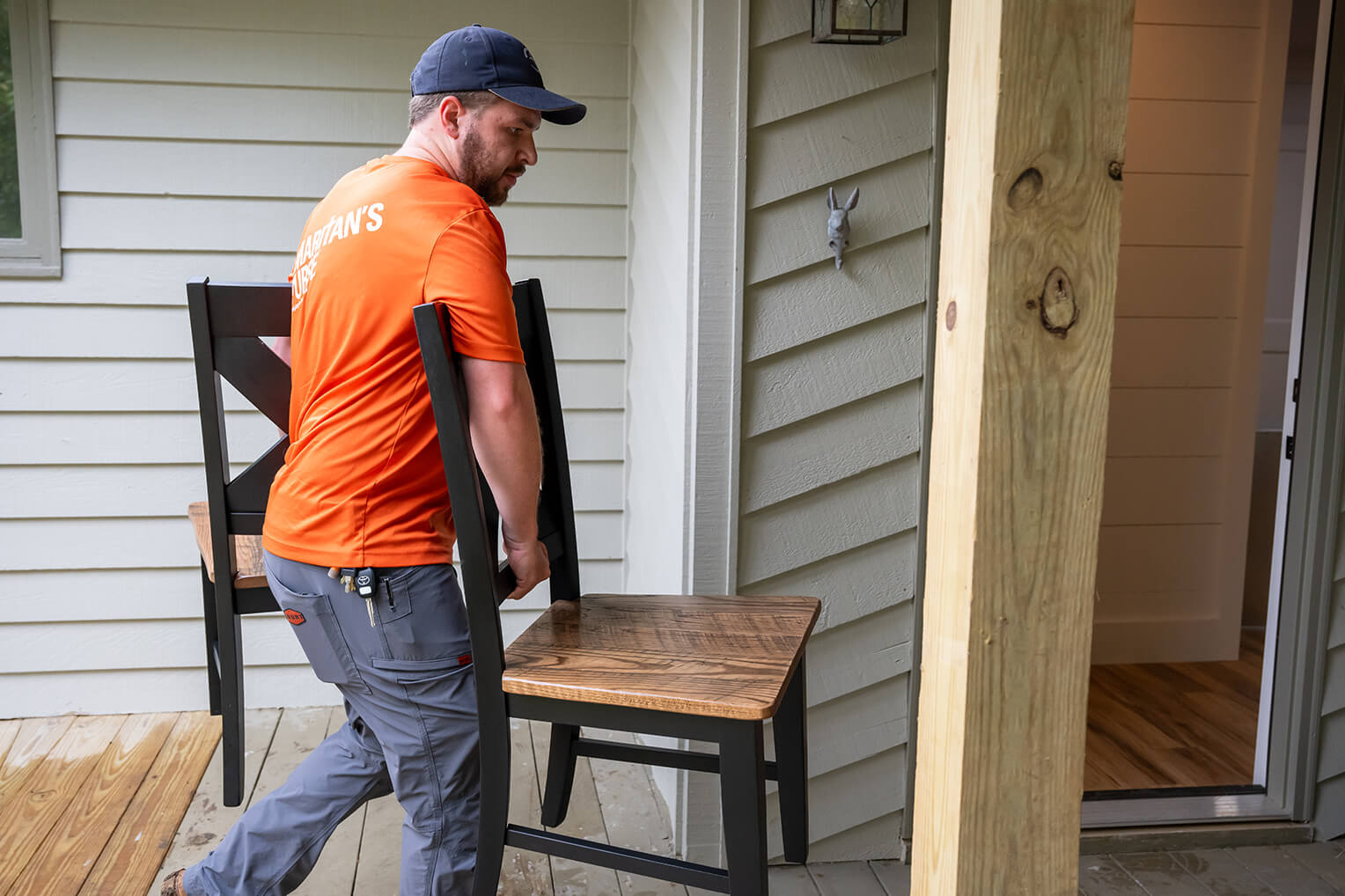 Samaritan's Purse staff member hauls chairs into the home