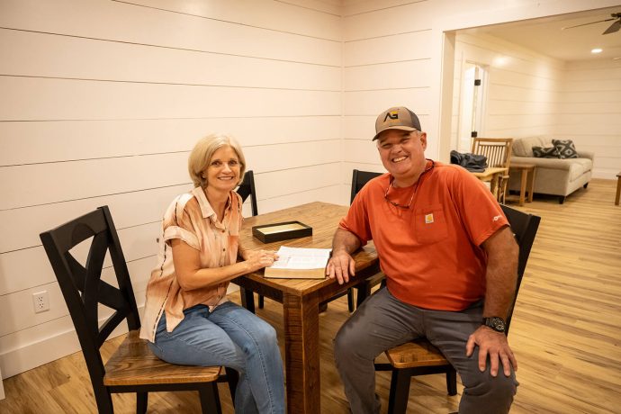 Homeowners enjoy their new dining room table