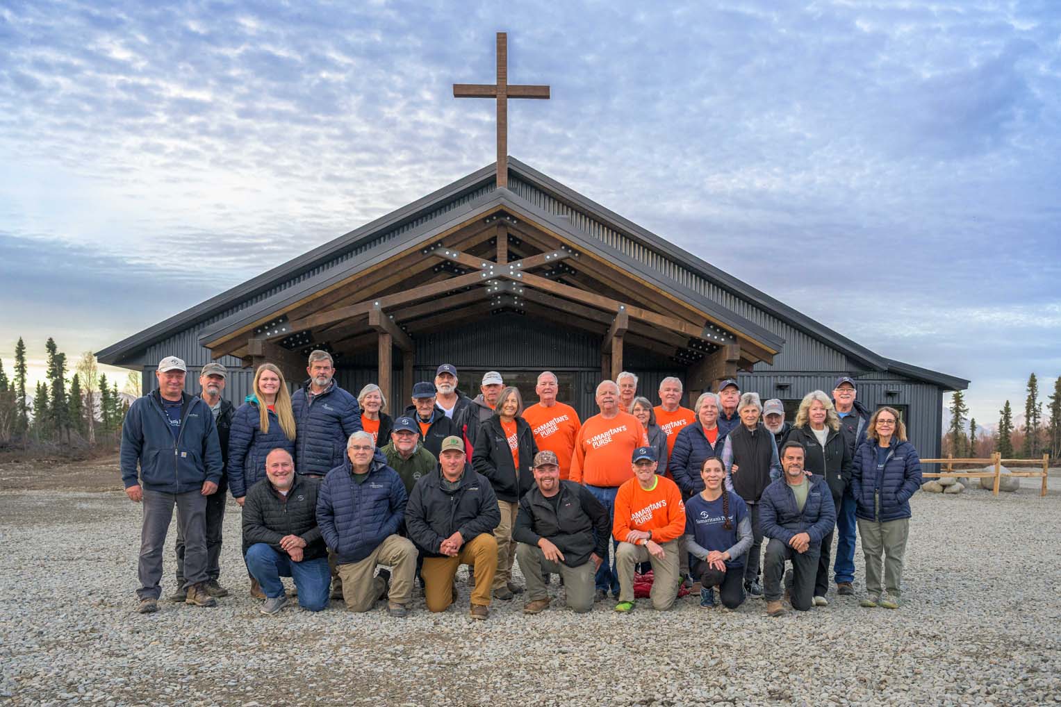 Volunteers and staff enjoy the fruits of their labor and pray for spiritual fruit after many weeks of work.