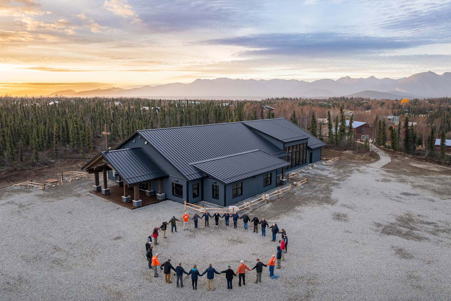 Volunteers and staff gathered to pray for the newly completed church building.