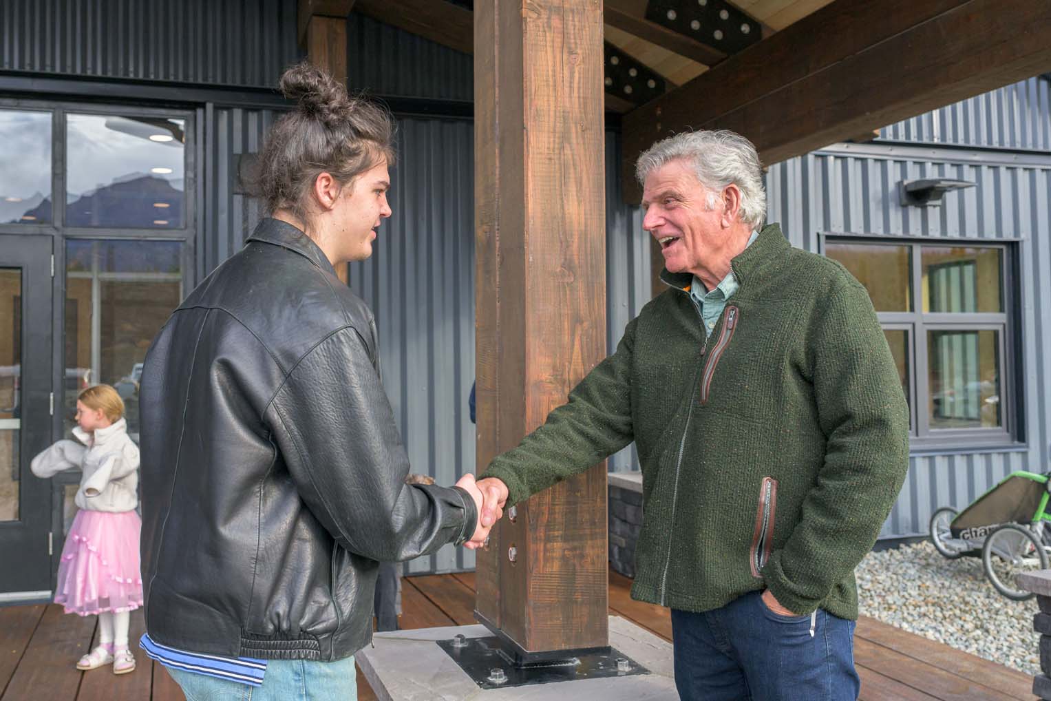 Franklin Graham greets church members as they enter their new church building.