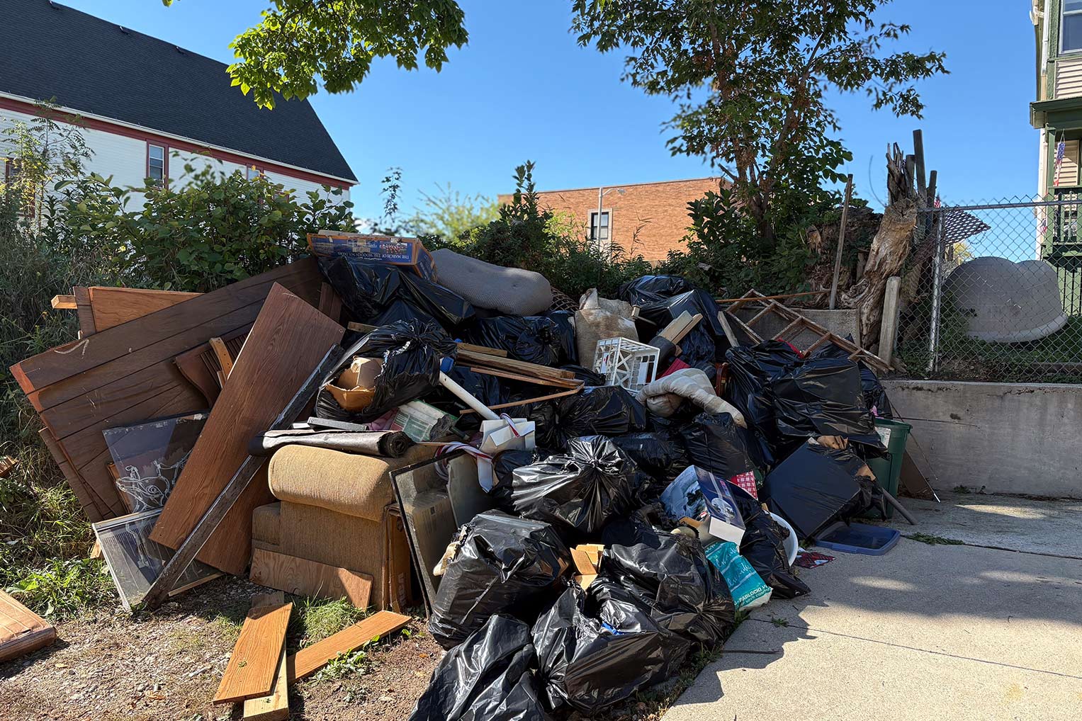 The historic flooding ruined nearly all of Aretha’s possessions that were stored downstairs. Volunteers assisted by removing the items out of her house to be picked up by the city.