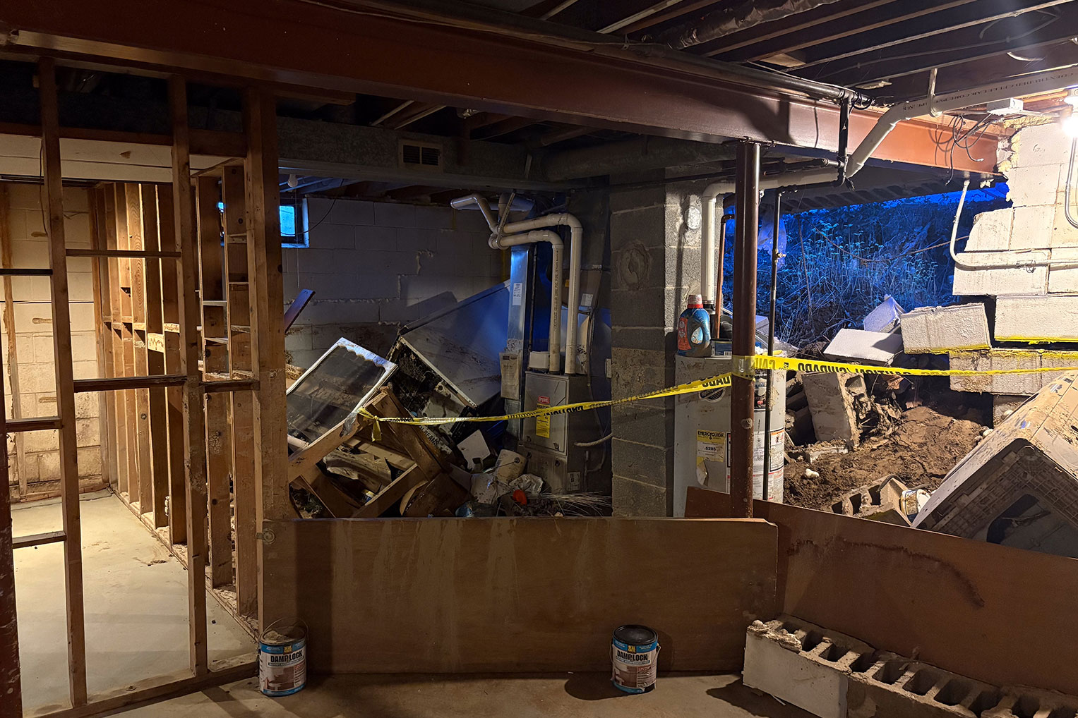 The storm broke down a wall in Delorse’s basement, letting in surge of water and debris.