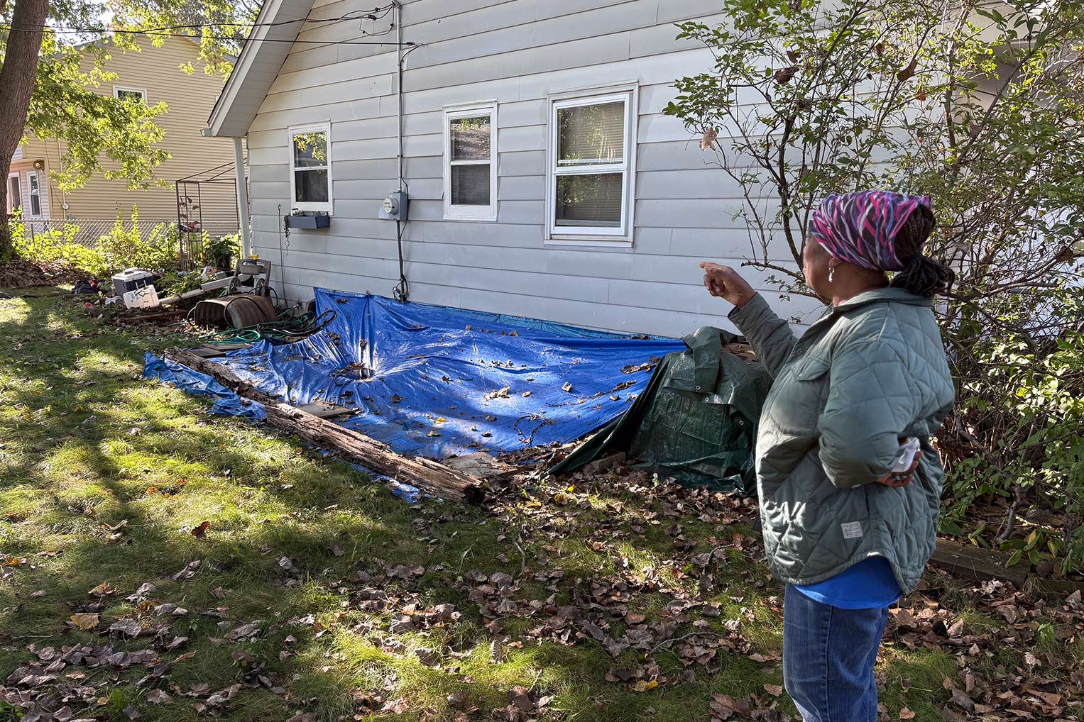 The storm left a gaping five-foot hole in Delorse’s basement. She covered it with a tarp, hoping to keep additional rainwater and animals from getting into her home.