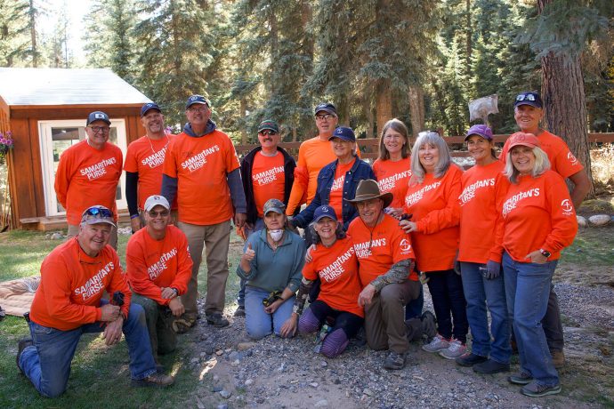Volunteers with homeowner they served