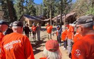 Volunteers pray with Colorado food victim