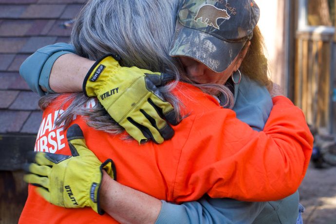 Volunteer embraces Dianne Paxton