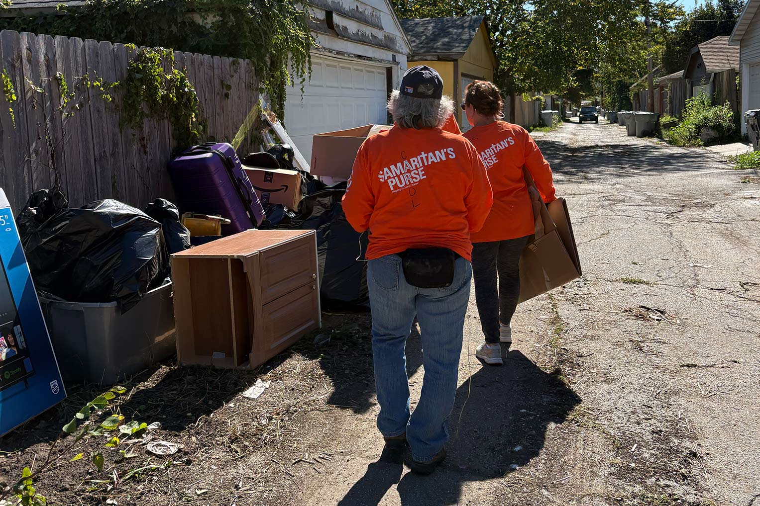 Volunteers served as the hands and feet of Jesus by helping homeowners remove waterlogged items from their flooded basements.