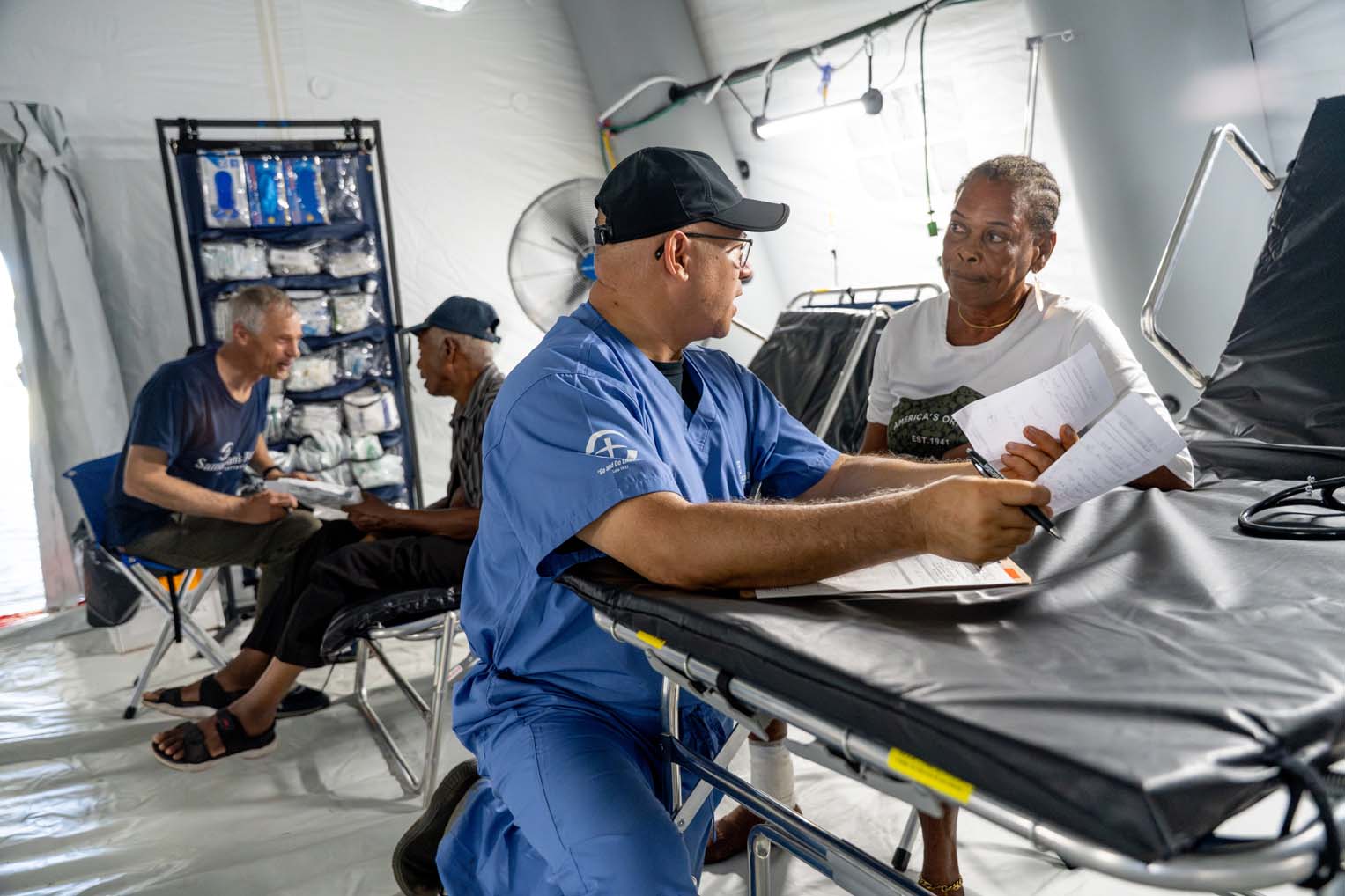 Medical staff members meet with Donna and Lasbourne before treatment.