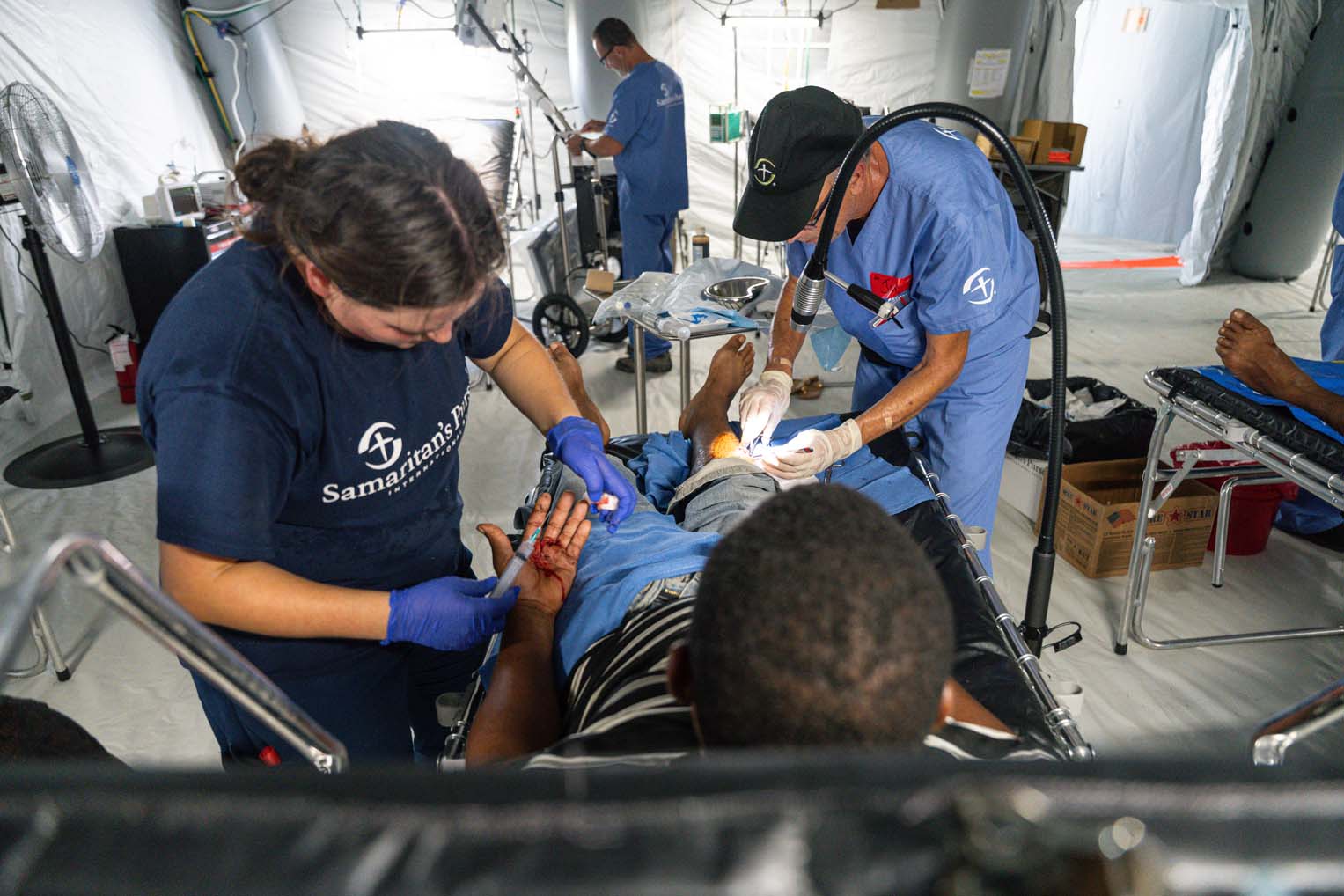 Samaritan’s Purse medical staff treat storm-related injuries inside the Emergency Field Hospital.
