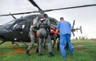 Samaritan’s Purse medical staff meet a patient transported by military helicopter.