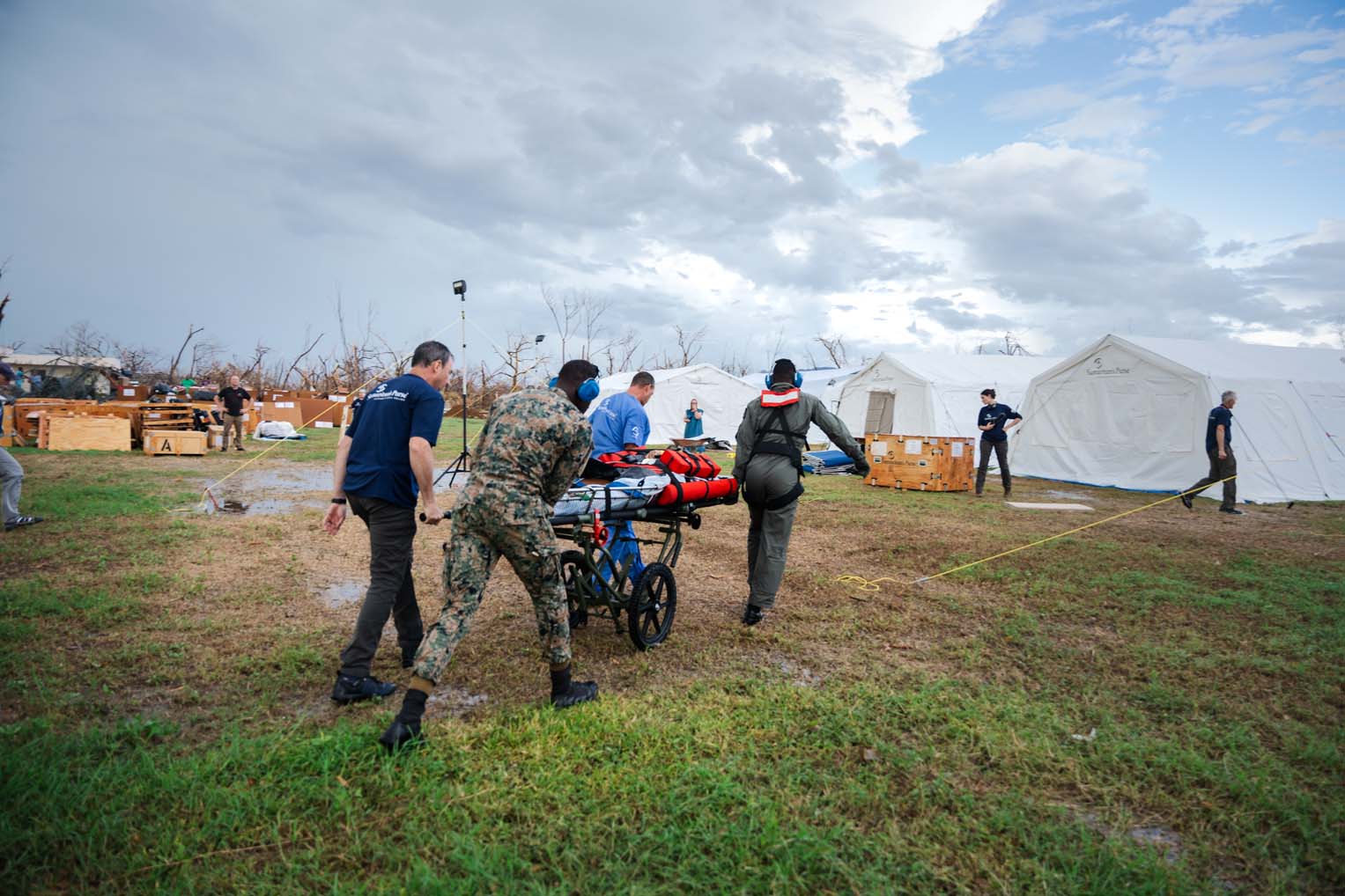 Team members rush a patient to the Samaritan’s Purse Emergency Field Hospital in Black River.