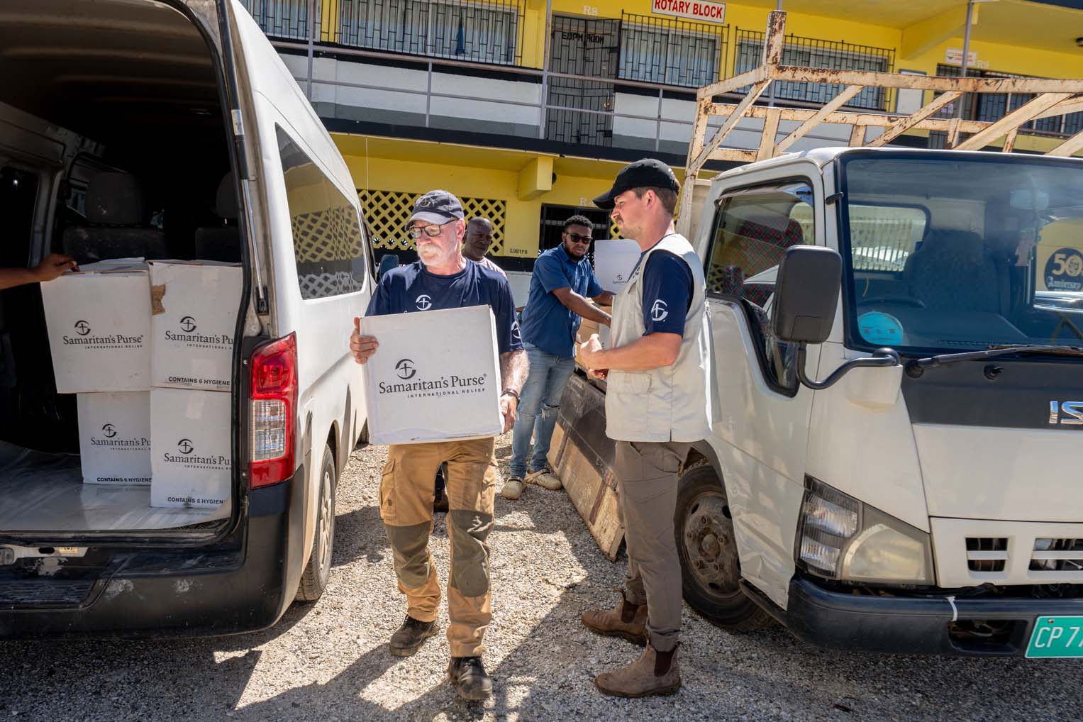 Volunteers and Samaritan’s Purse staff unload hygiene kits to serve hard-hit communities across the Black River region.