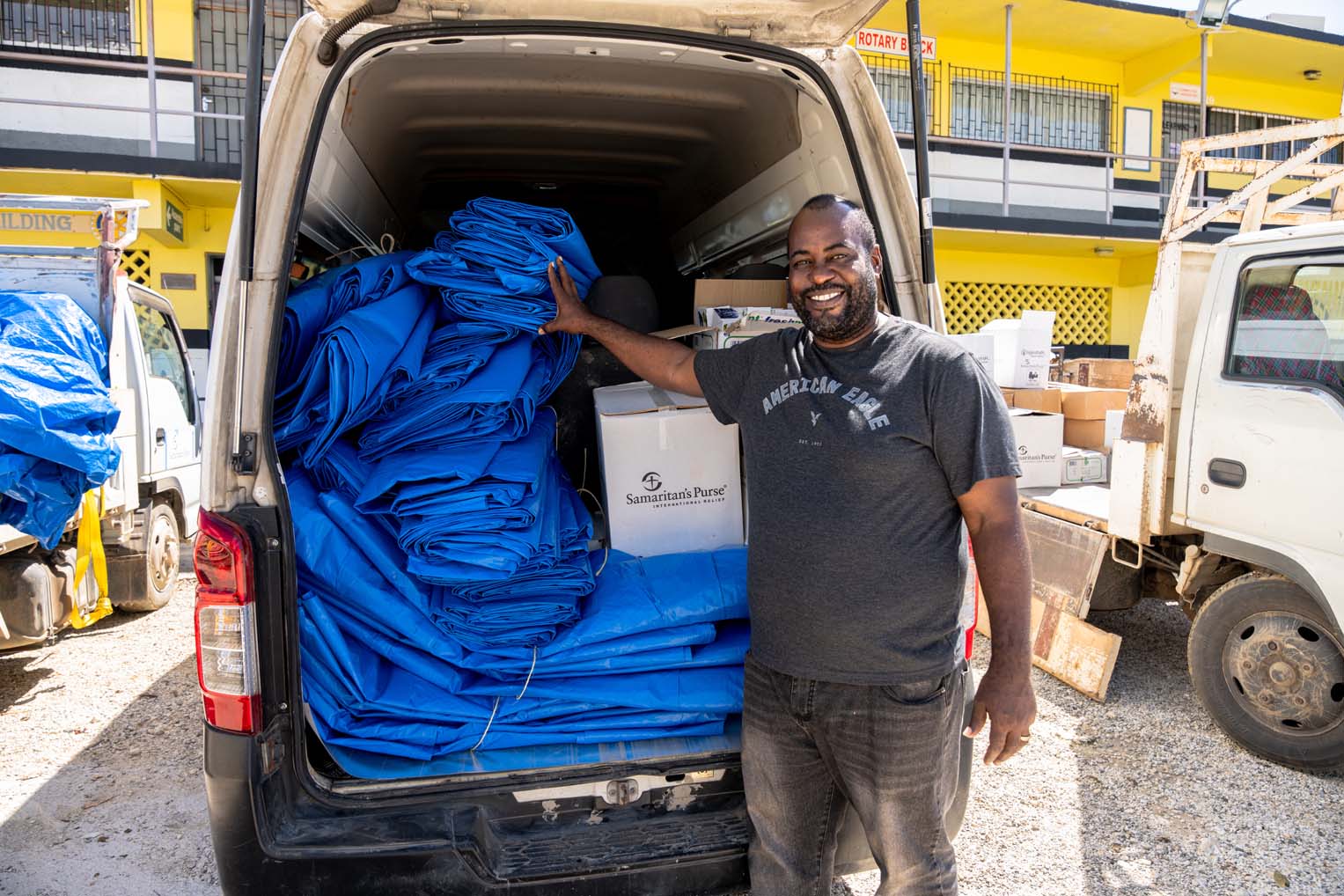 Pastor Bennett prepares to deliver shelter tarps and critical supplies to families in need.