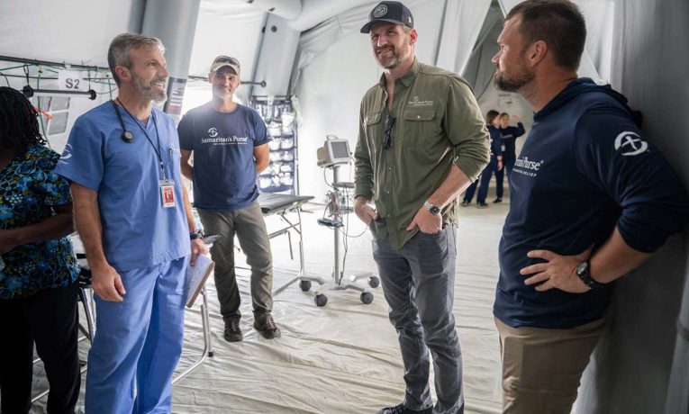 Edward Graham listens as doctors describe how God is using their hands to bring healing and hope to hurricane survivors in Jamaica.