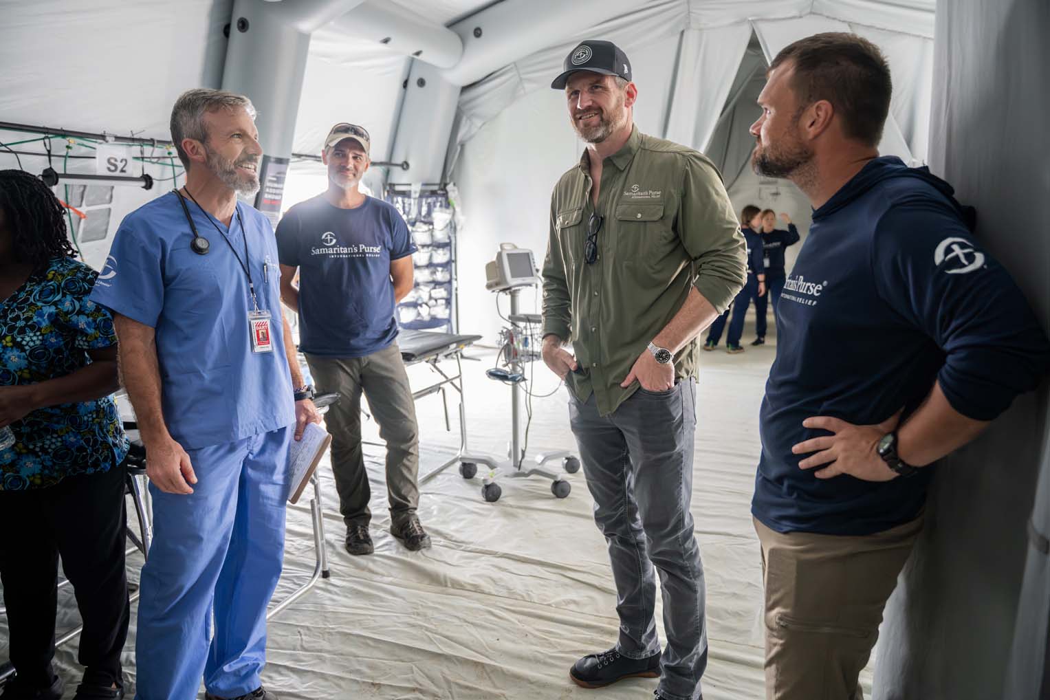 Edward Graham listens as medical staff describe how God is using our field hospital to bring healing and hope to hurricane survivors in Jamaica.