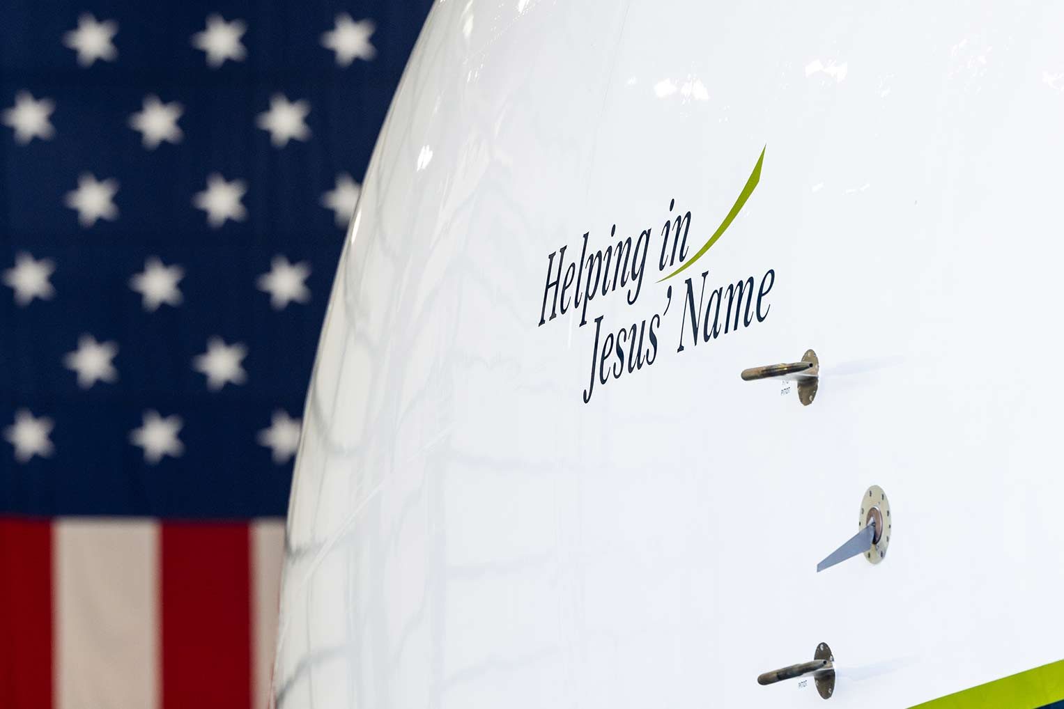 2592US-A-1343-resized "Helping in Jesus' Name" is displayed prominently on each of our aircraft.