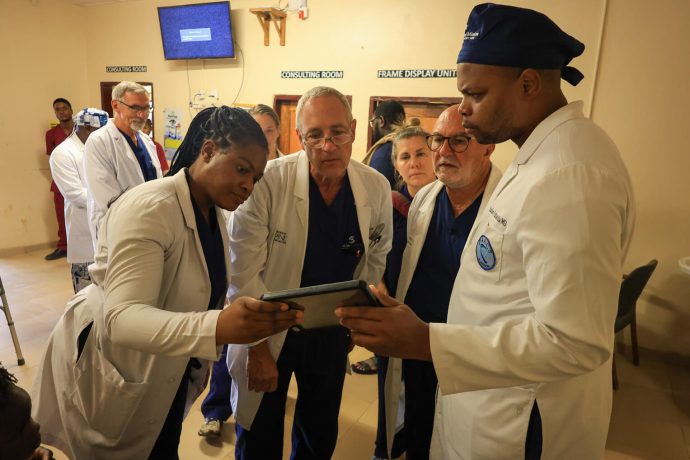 Dr. Hellwarth (center left) has served with World Medical Mission for decades, performing surgeries in foreign operating rooms around the world  for God's glory. 