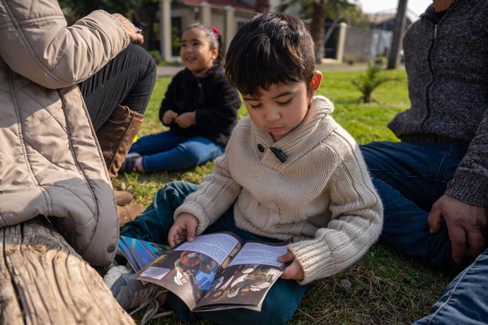 Chilean boy with The Greatest Gift booklet