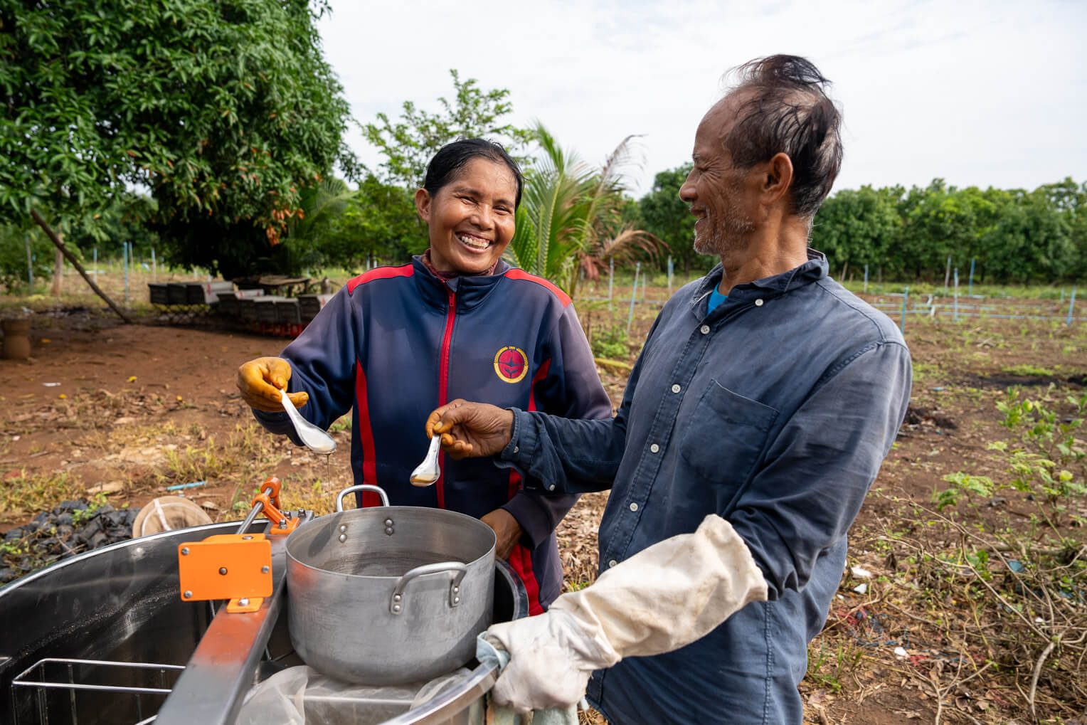 Pastor Tith Hang enjoys the fruit of his labor: fresh, delicious honey made by thousands of bees in the hives provided by Samaritan's Purse.
