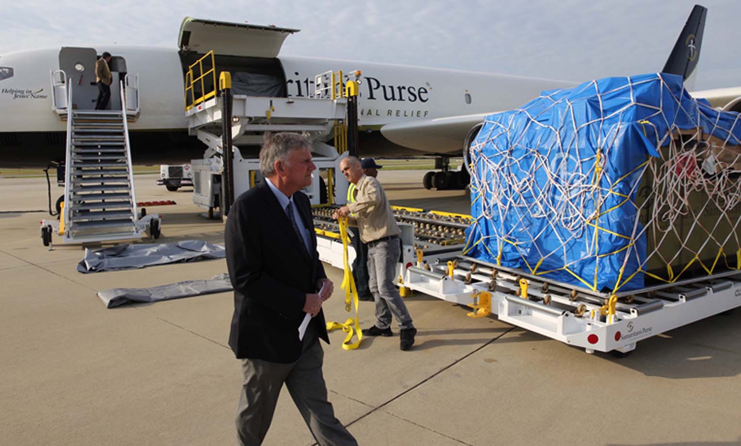 Samaritan's Purse President Franklin Graham surveys the load before the DC-8s inaugural flight to Ecuador in 2016.