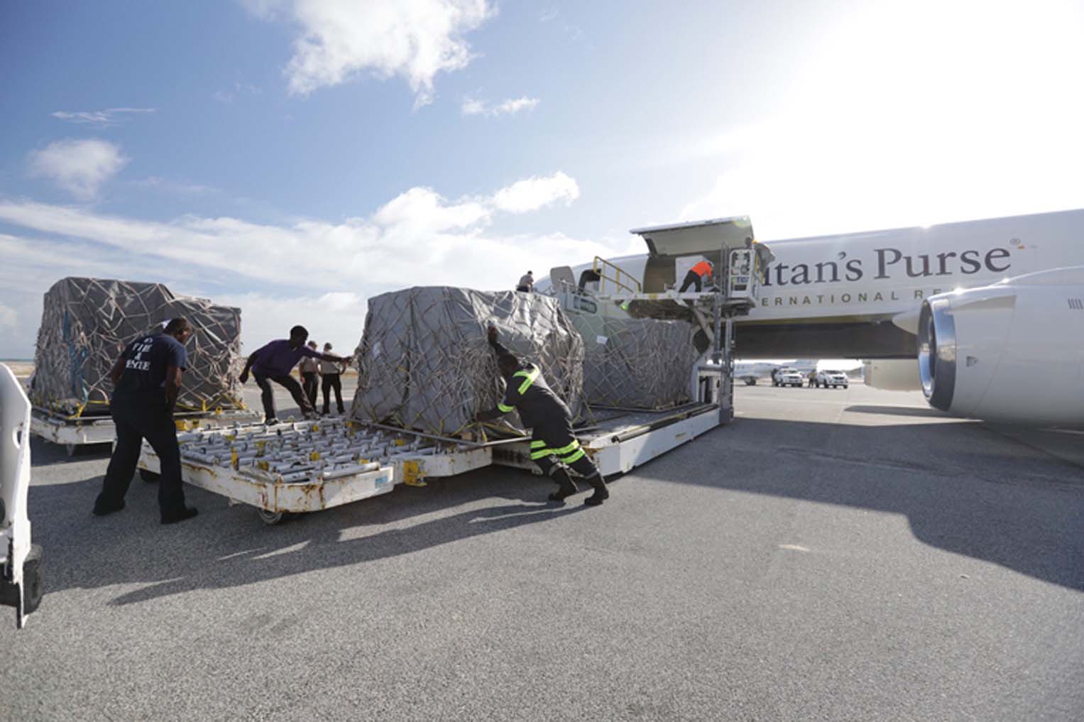 Ground crews in the Caribbean offload the DC-8 after hurricanes hit the islands.