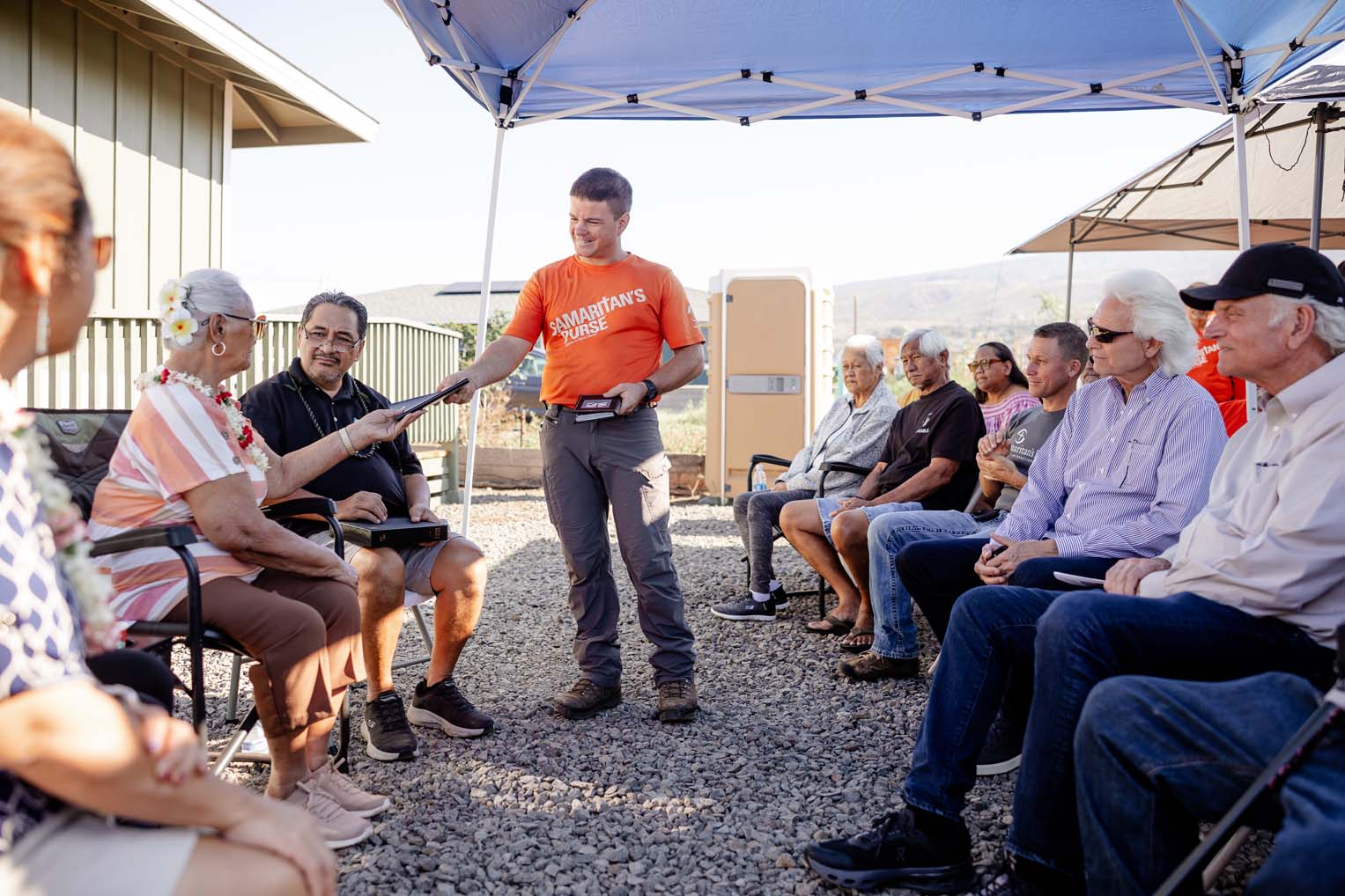 Franklin Graham joins staff and volunteers as they dedicate Aunty K's new home built by Samaritan's Purse.