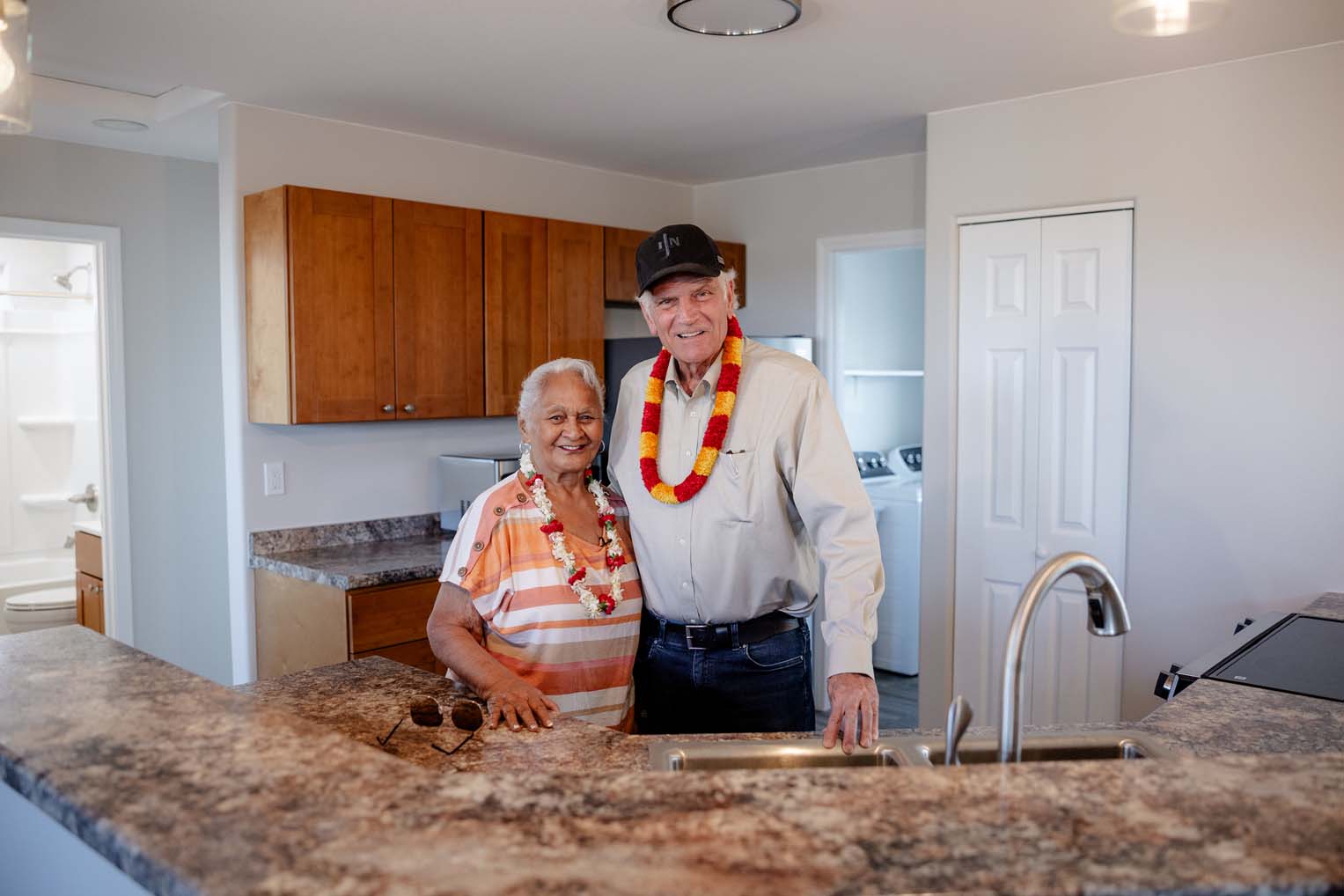 Graham celebrates with Aunty Keala as she acquaints herself with the new home provided by Samaritan's Purse.