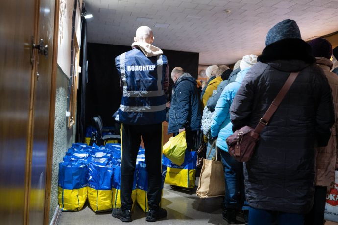 Bags of groceries being delivered to a group of Ukrainians