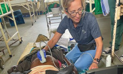 Susan Hopkins performs an ultrasound on an expectant mother at Karanda Hospital in Zimbabwe.
