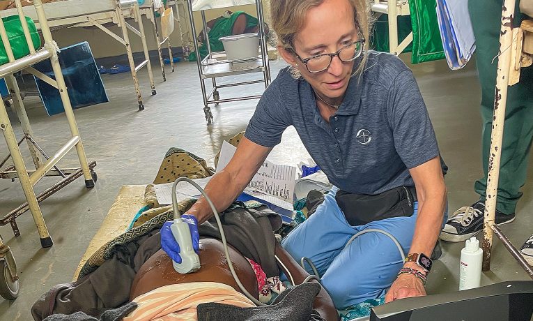 Susan Hopkins performs an ultrasound on an expectant mother at Karanda Hospital in Zimbabwe.