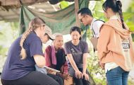 Samaritan's Purse staff pray with blind woman in Cambodia