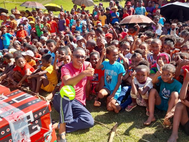 Crowd awaits Gospel presentation at outreach event