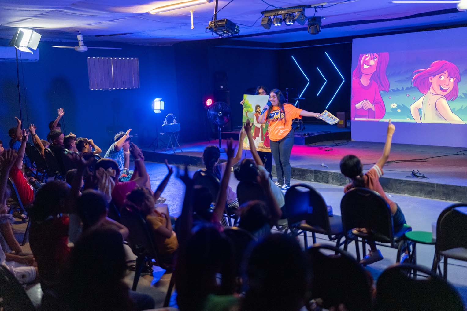 J shares the Gospel with students.