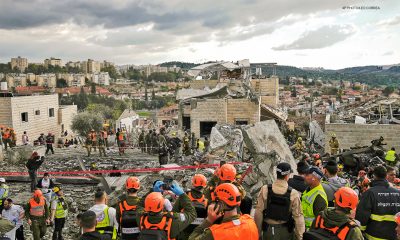 Rescue workers and others respond where several people were killed by an Iranian missile attack on Beit Shemesh. AP Photo